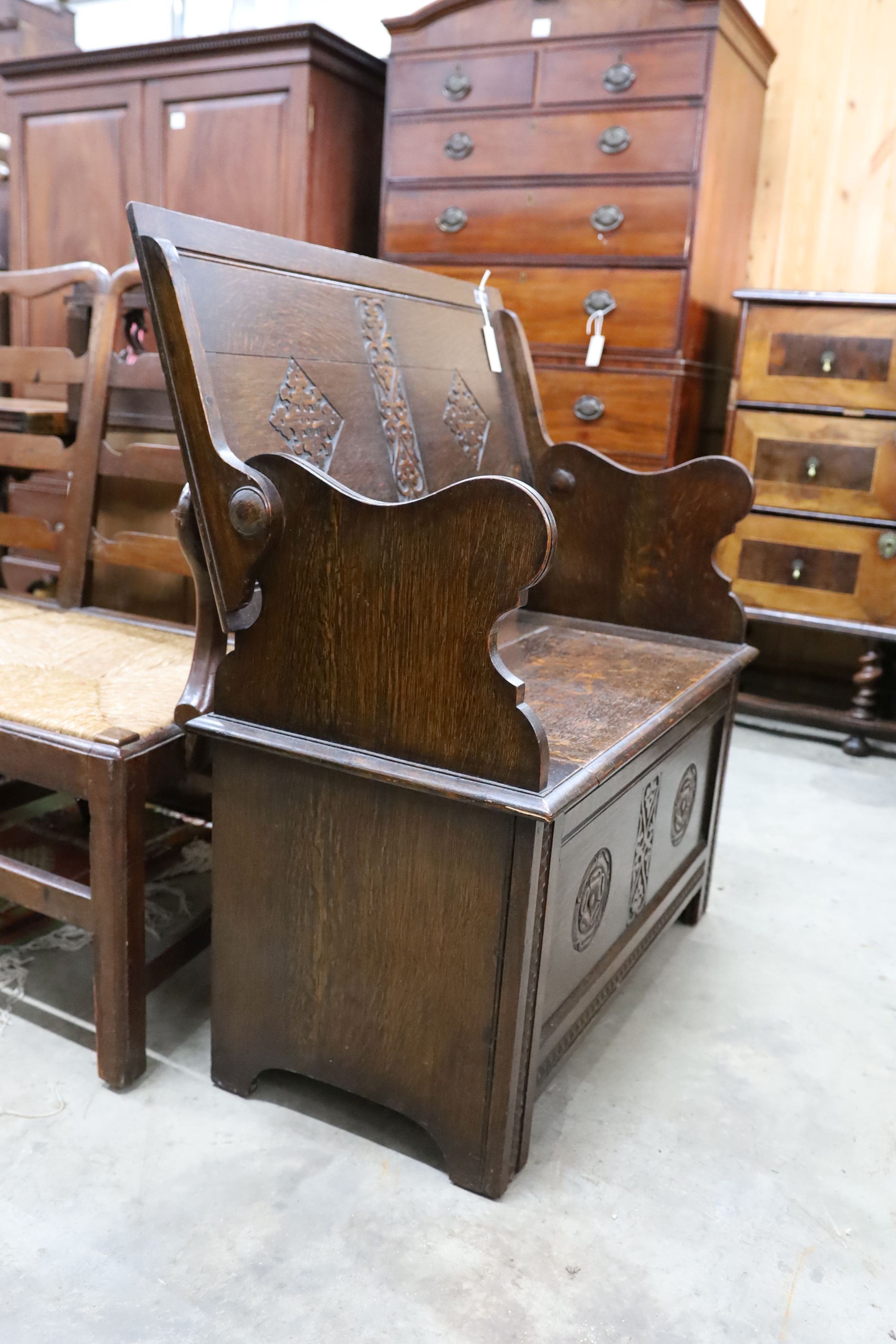 A 1930's oak monk's bench, length 87cm, depth 44cm, height 77cm